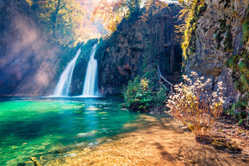 Incredible morning view of pure water waterfall in Plitvice National Park. Spectacular autumn scene of Croatia, Europe. Abandoned places of Plitvice lakes series. Beauty of nature concept background.