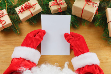 Close-up of Christmas letter in Santa Claus hands