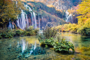 Attractive morning view of pure water waterfall in Plitvice National Park. Amazing autumn scene of Croatia, Europe. Abandoned places of Plitvice lakes series. Beauty of nature concept background.