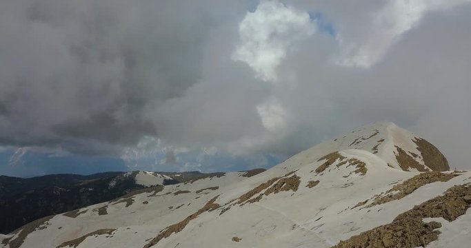 Aerial view on the mountain tops covered in snow at the Tahtali mountain, 4k