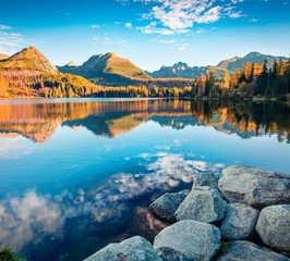 Gorgeous autumn view of Strbske pleso lake. Captivating morning scene of High Tatras National Park, Slovakia, Europe. Beauty of nature concept background.