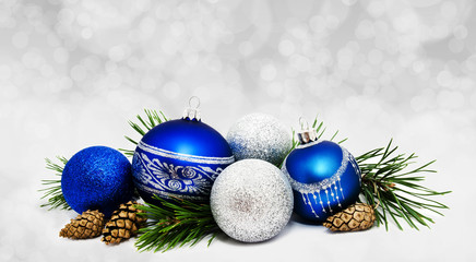 Christmas perfect decoration blue and silver balls isolated on golden blurred bokeh background