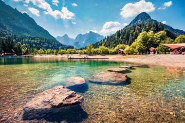 Sunny morning view of Jasna lake. Splendid summer scene of Julian Alps, Gozd Martuljek location,...