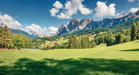 Obraz premium Sunny morning view of Cortina d’Ampezzo resort. Bright summer scene of Dolomiti Alps, Province of Belluno, Italy, Europe. Beauty of countryside concept background.