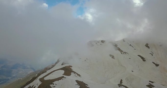 Aerial footage of the top of the Tahtali mountain, flying through the cloud, 4k