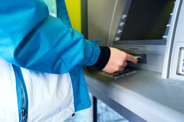 the girl raises money from the ATM - Image