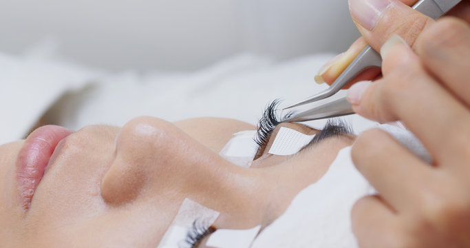 Beautiful young woman with eyelash extension