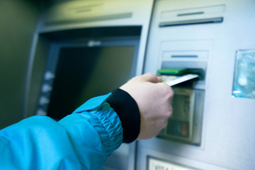 the girl raises money from the ATM - Image