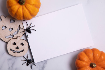 Blank white halloween card with pumpkins and spiders. Poster invitation mockup