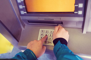 the girl raises money from the ATM - Image