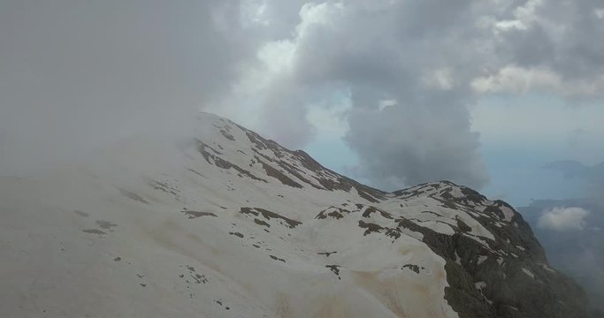 Clouds at the mountain top, flying through the cloud, drone shot, 4k