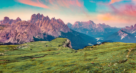 Captivating summer sunrise in National Park Tre Cime di Lavaredo with Cadini di Misurina range and Sorapis group on background. Fantastic morning view of Dolomiti Alps, Italy, Europe.