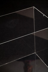 Glass transparent box on black background