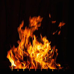 Fire flame. A fire in the grill, fireplace and hearth. Burning fire at night.