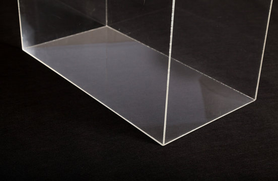 Glass transparent parallelepiped on black background