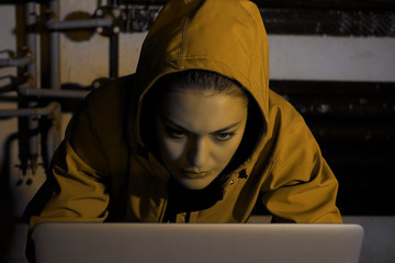 Young Female Hacker Breaks into Corporate Data Servers from His Underground Hideout. Place Has Dark Atmosphere - Image