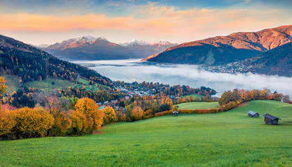 Fabulous view of Zell lake. Colorful autumn sunrise in Austrian town - Zell am See, south of the city of Salzburg. Beauty of nature concept background.