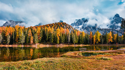 Misty outdoor scene of Antorno lake. Colorful autumn morning in Dolomite Alps, National Park Tre Cime di Lavaredo, Italy, Europe. Amazing world of Alpine Mountains.