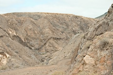 Fototapeta na wymiar Panoramic view of an arid canyon path in Porto Santo (Madeira Islands, Portugal)