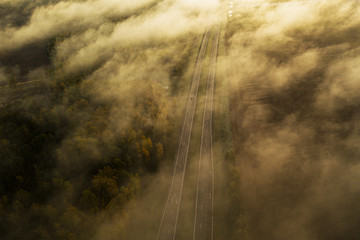 Aerial: dense fog above the highway