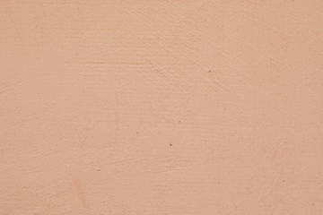 Close-up of smooth beige painted wall of a building