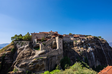 Fototapeta na wymiar Meteora Monastery in Greece, built on rocks. Sunny day, blue sky.