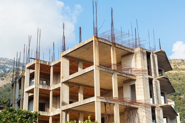 Unfinished building or house, concrete walls and iron bars