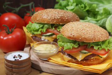 Two fresh hamburgers with vegetables	