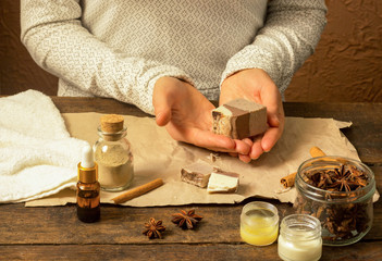Fototapeta na wymiar Woman hands holding natural handmade soap with cocoa and cinnamon