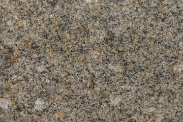 Elevated view of black and yellow granite stone surface
