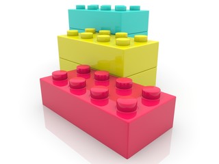 Colorful toy brick building on a white background