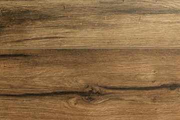 Obraz na płótnie Canvas Close-up of dark brown laminate floor covering