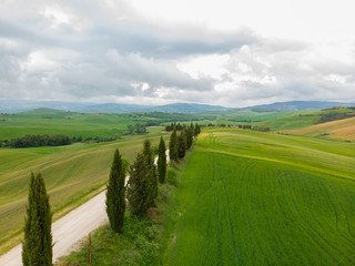 Fototapeta na wymiar Tuscany countryside hills, stunning aerial view in spring.