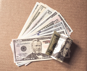 Heap of US dollars on paper, top view