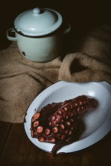 Octopus. Seafood in the restaurant. Octopus is prepared in the restaurant on the table.