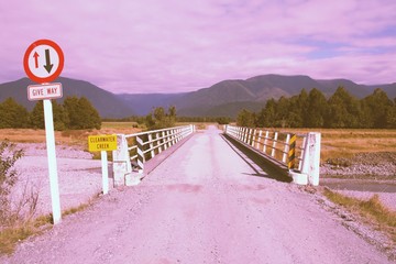 One way bridge in New Zealand. Retro filtered colors style.