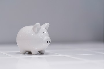 White piggy bank on the white background