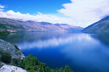 Fototapeta na wymiar Lake in New Zealand - Wakatipu. Retro filtered colors style.