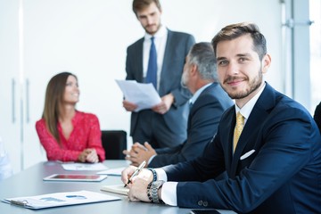 Businessman sitting in board room during new project discussion.