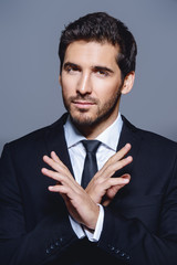 businessman crosses his arms