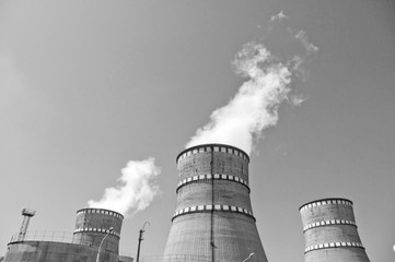 Atomic reactor. Operating nuclear power plant. Smoke from the chimney, black and white. Power...