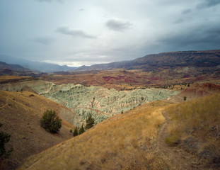Breathtaking views of the grey-blue badlands and the John Day river valley from the Blue Basin Overlook Trail at the John Day Fossil Beds in Kimberly Oregon