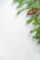 Christmas greeting card background with fir tree and decoration, white table background flat lay top view copy space