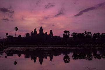 Fototapeta na wymiar Sunrise at reflection pond, Angkor Wat