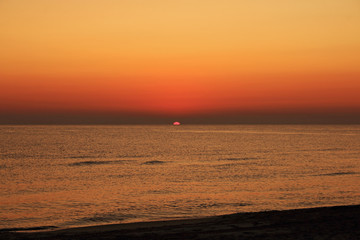 Orange sunrise on the beach