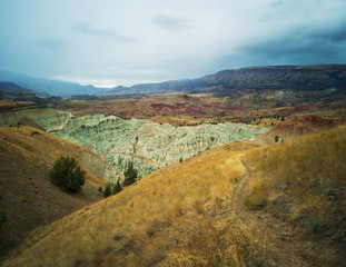 Breathtaking views of the grey-blue badlands and the John Day river valley from the Blue Basin Overlook Trail at the John Day Fossil Beds in Kimberly Oregon