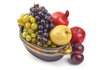 Sweet fresh juicy fruits, apples, grapes, grapefruit, plums, isolated on white background