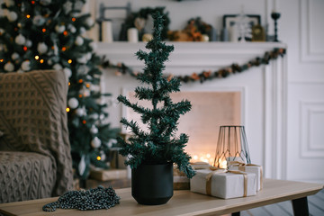 Decorated fireplace in a home with Christmas tree