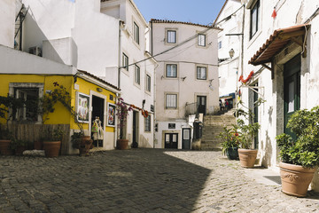 typical portuguese cobblestone street in Lisbon