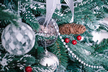 Closeup on Christmas tree decoration over festive background